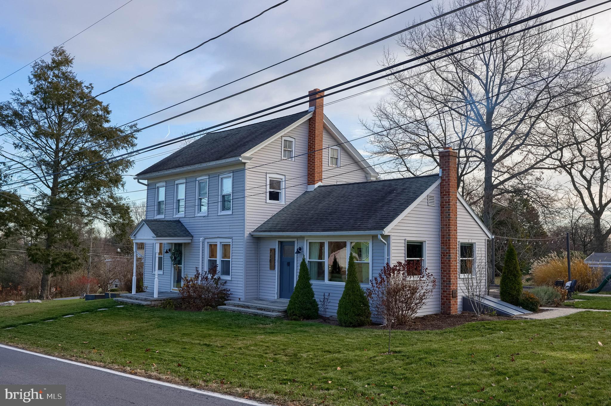 770 Mohns Hill Road Reading, PA 19608 - Photo 48 of 53 a front view of a house with a garden and porch