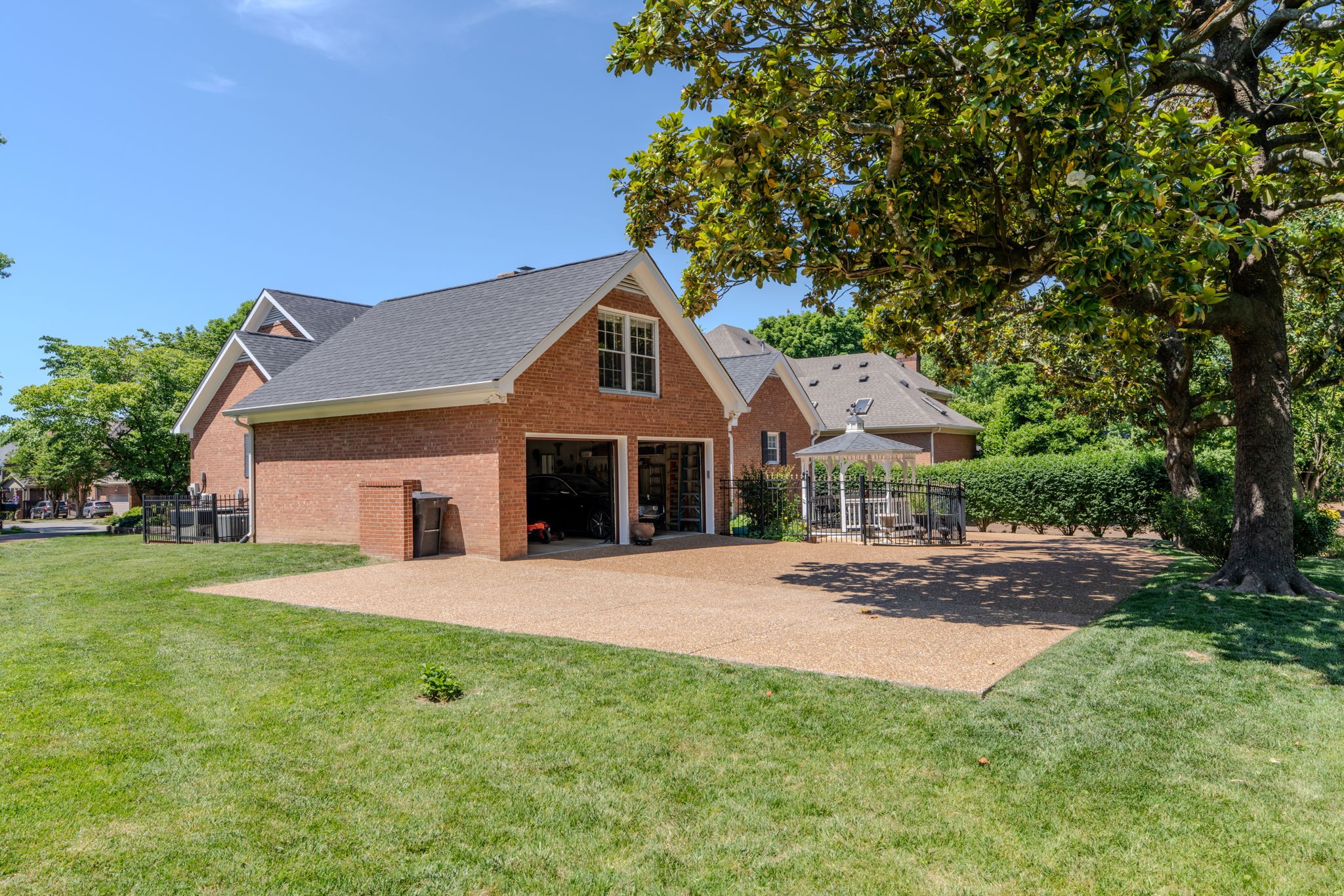 404 Chesterfield Place Franklin, TN 37064 - Photo 31 of 38 a front view of a house with a yard and trees