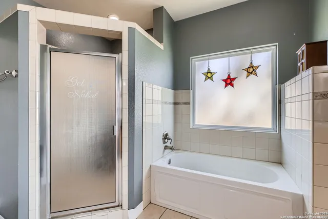 a bathroom with a sink vanity and a mirror