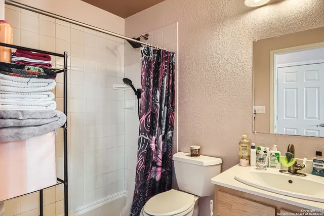 a view of living room with furniture and floor to ceiling window