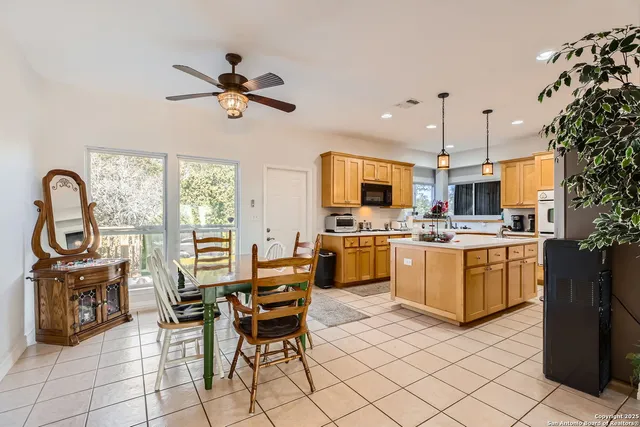 a kitchen that has a sink stainless steel appliances a counter space and a window