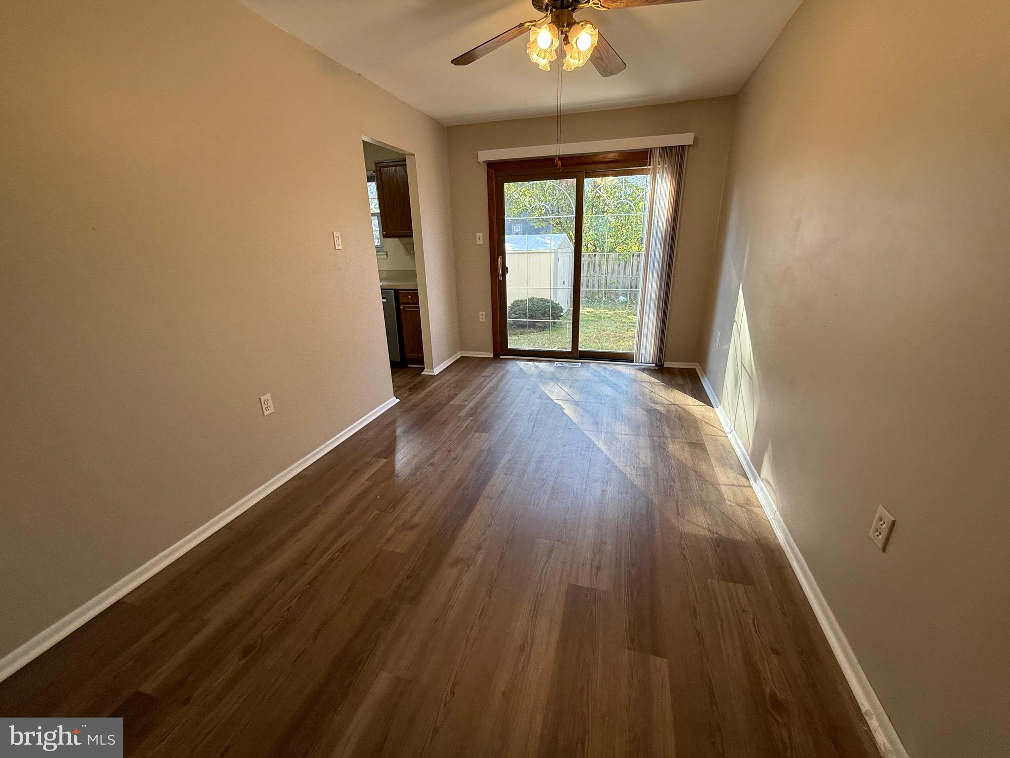 34 King Charles Circle, Unit 34 Rosedale, MD 21237 - Photo 12 of 25 wooden floor in an empty room with a window