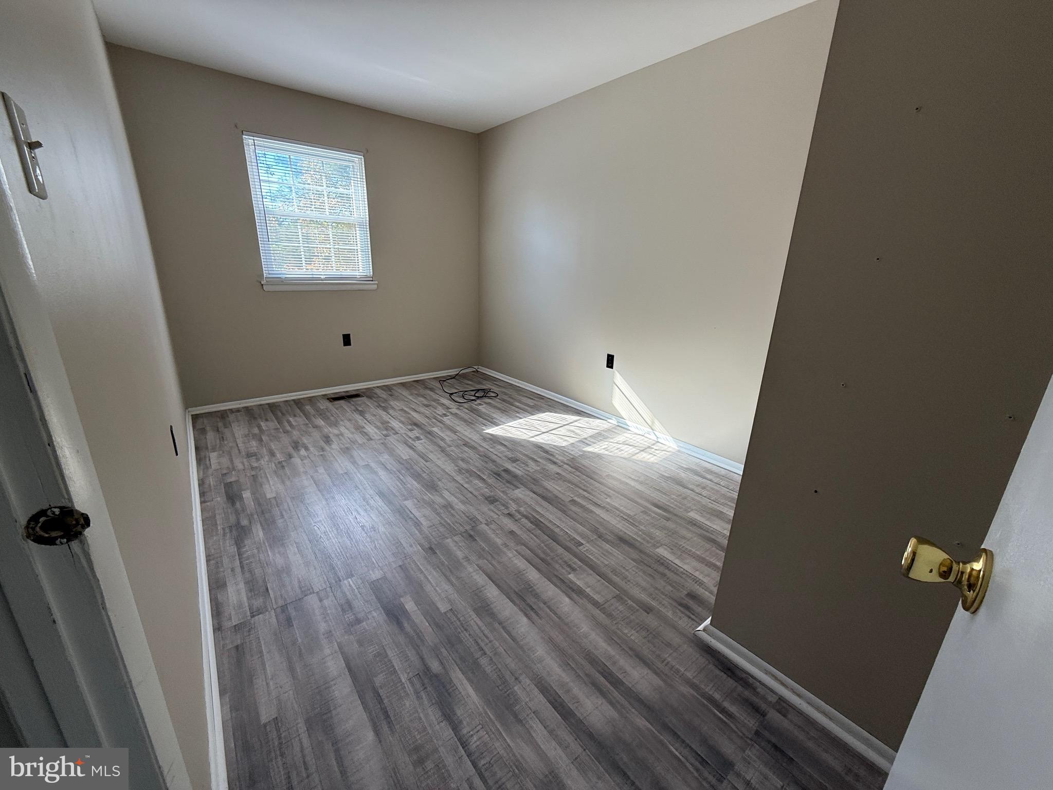 34 King Charles Circle, Unit 34 Rosedale, MD 21237 - Photo 13 of 25 a view of empty room with wooden floor