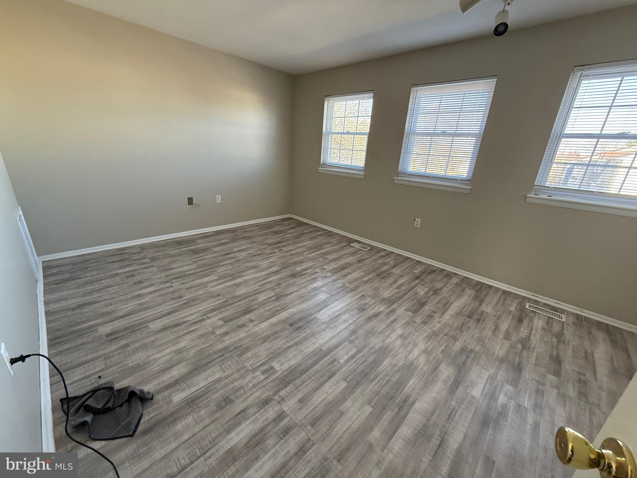 34 King Charles Circle, Unit 34 Rosedale, MD 21237 - Photo 15 of 25 an empty room with windows