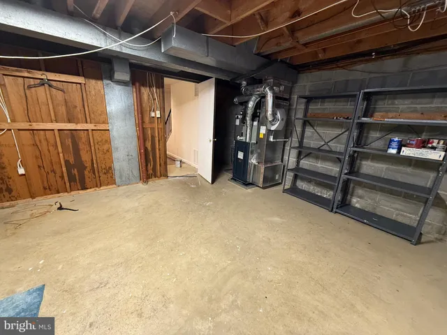 a view of a patio with table and chairs and wooden fence