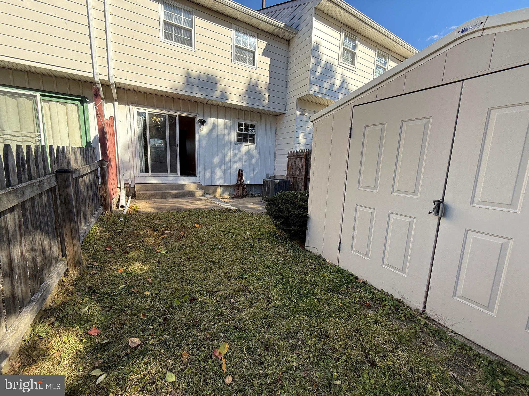 34 King Charles Circle, Unit 34 Rosedale, MD 21237 - Photo 21 of 25 a view of a patio with table and chairs and wooden fence