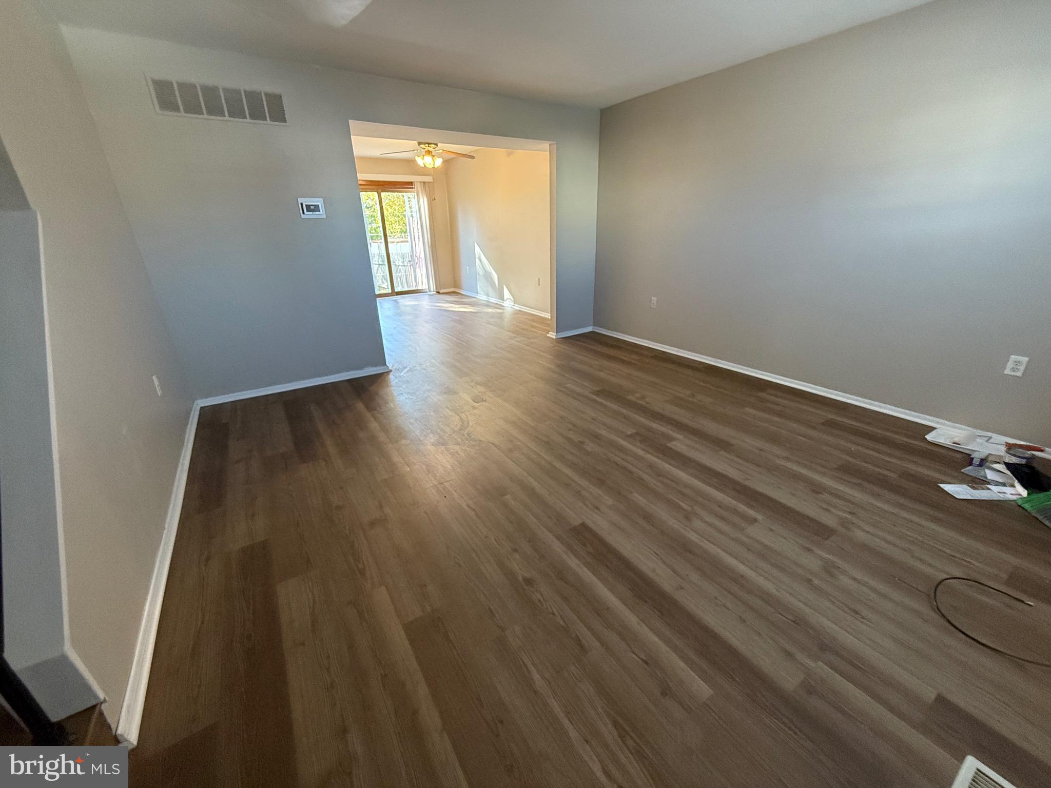34 King Charles Circle, Unit 34 Rosedale, MD 21237 - Photo 4 of 25 wooden floor in an empty room with a window