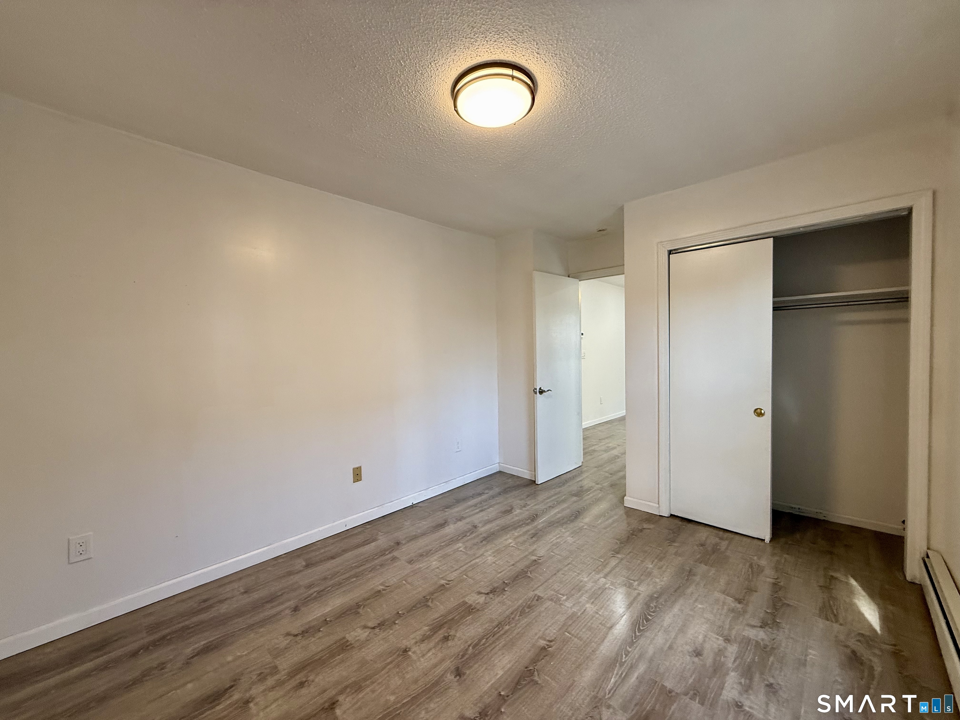 8 Scott Street, Unit 2 Naugatuck, CT 06770 - Photo 12 of 15 a view of room with wooden floor