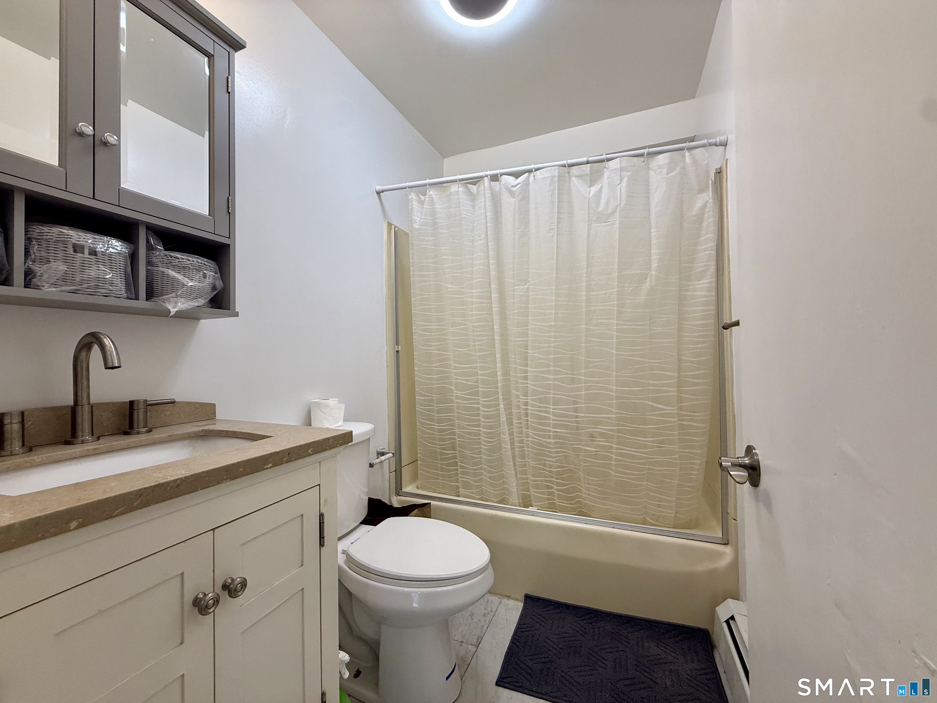 8 Scott Street, Unit 2 Naugatuck, CT 06770 - Photo 15 of 15 a bathroom with a granite countertop bathtub shower sink vanity mirror and toilet
