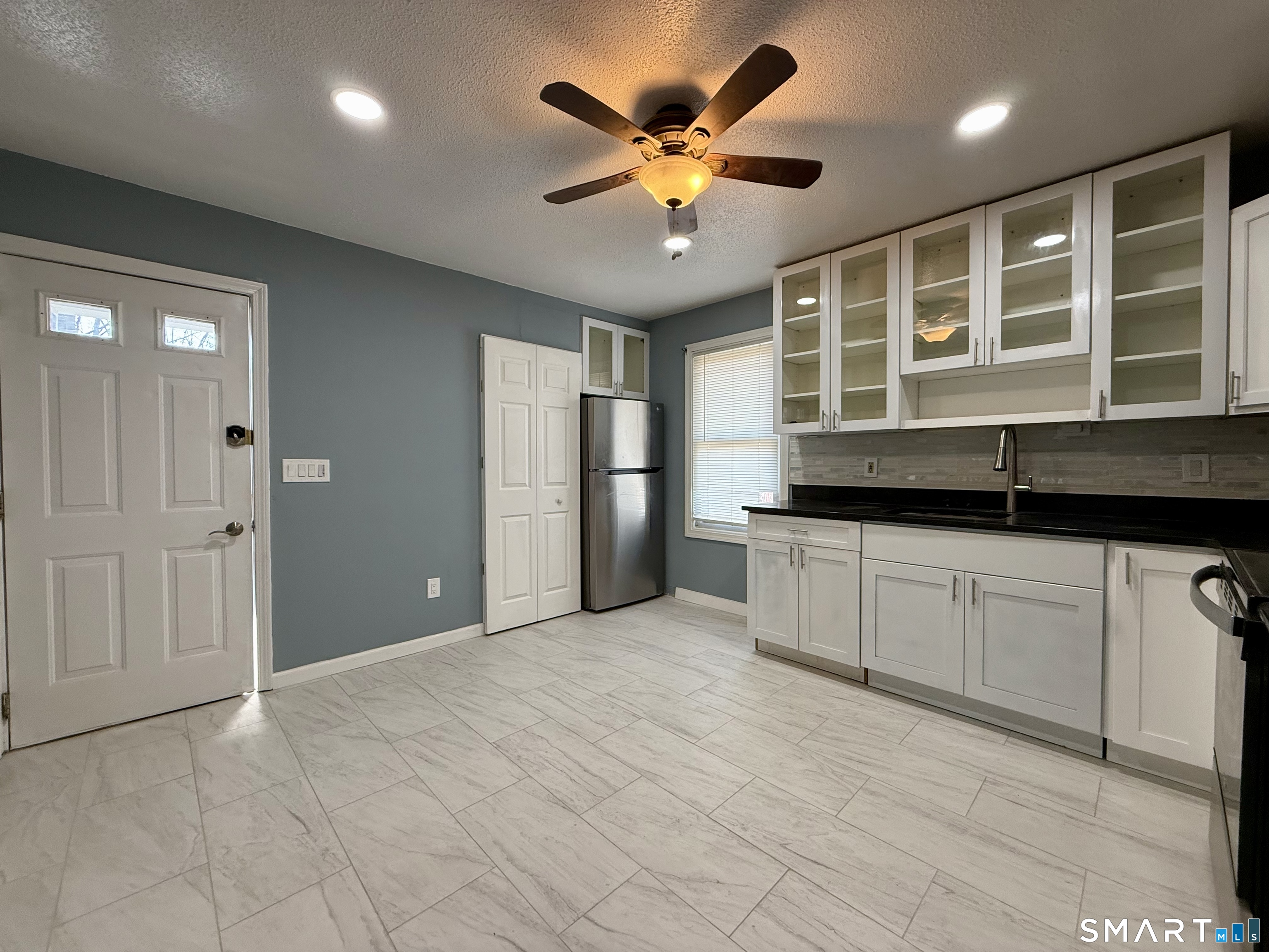 8 Scott Street, Unit 2 Naugatuck, CT 06770 - Photo 2 of 15 a view of an empty room with a kitchen