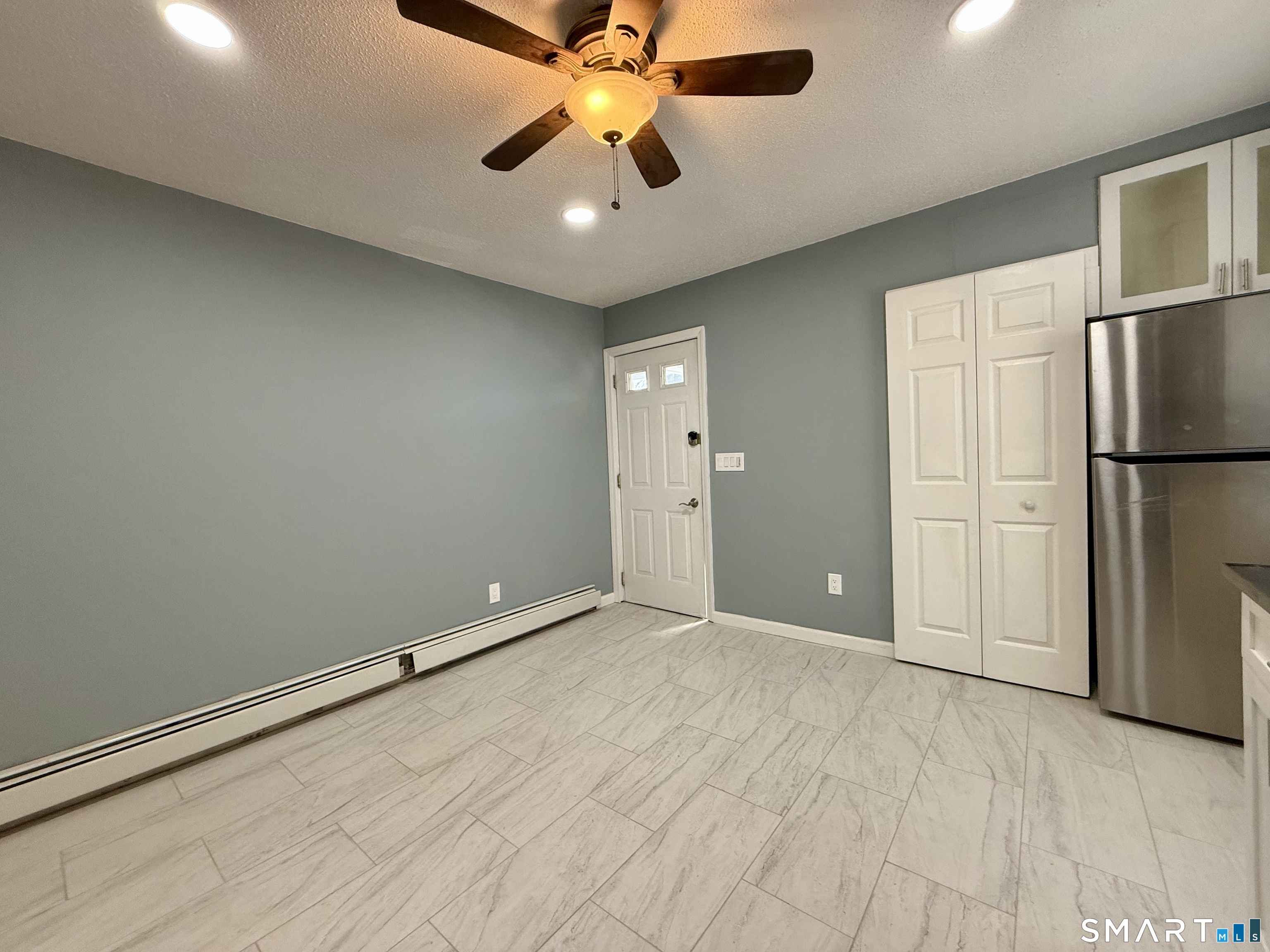 8 Scott Street, Unit 2 Naugatuck, CT 06770 - Photo 3 of 15 a view of an empty room with a ceiling fan