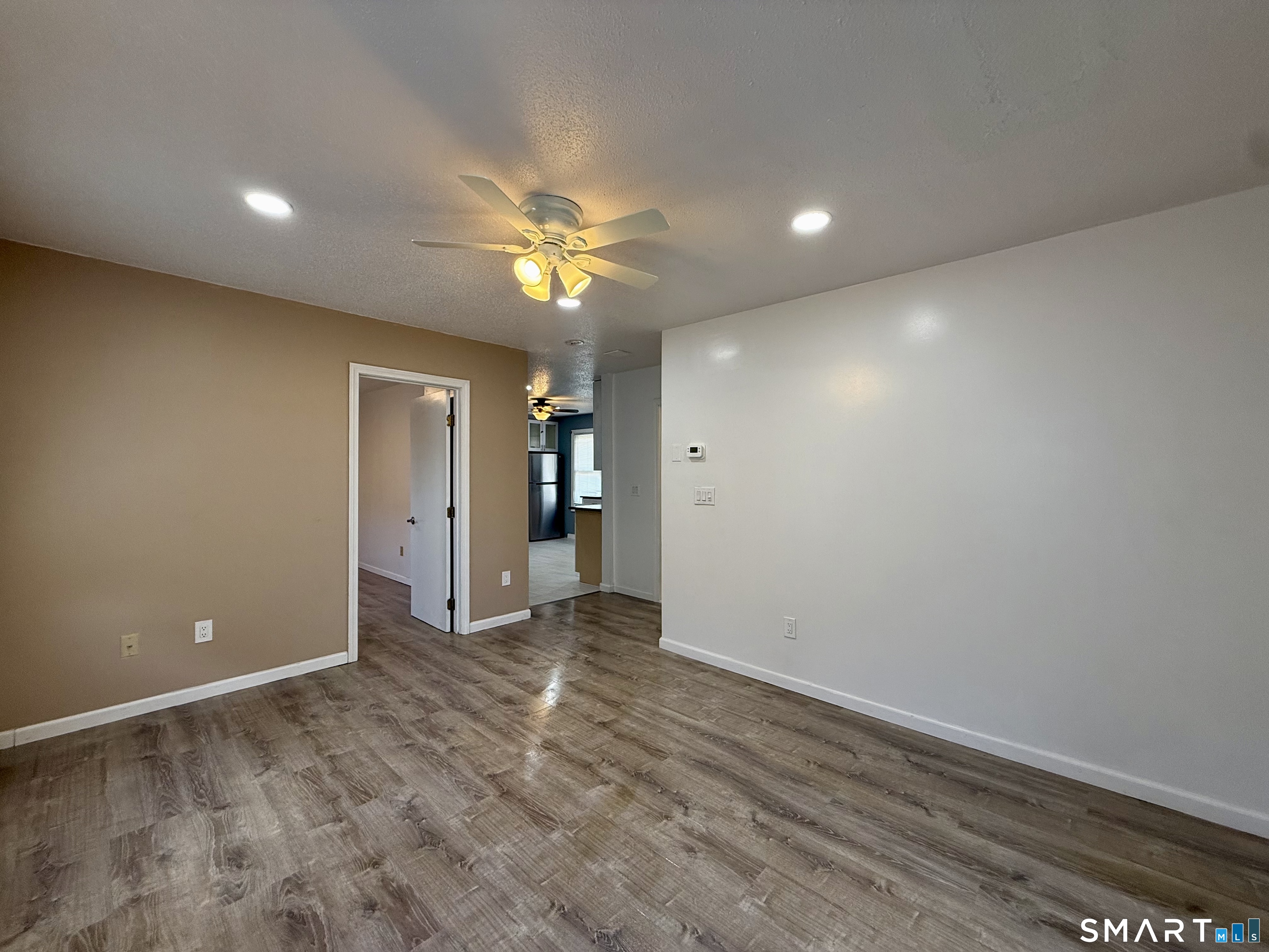 8 Scott Street, Unit 2 Naugatuck, CT 06770 - Photo 4 of 15 wooden floor in an empty room with a window