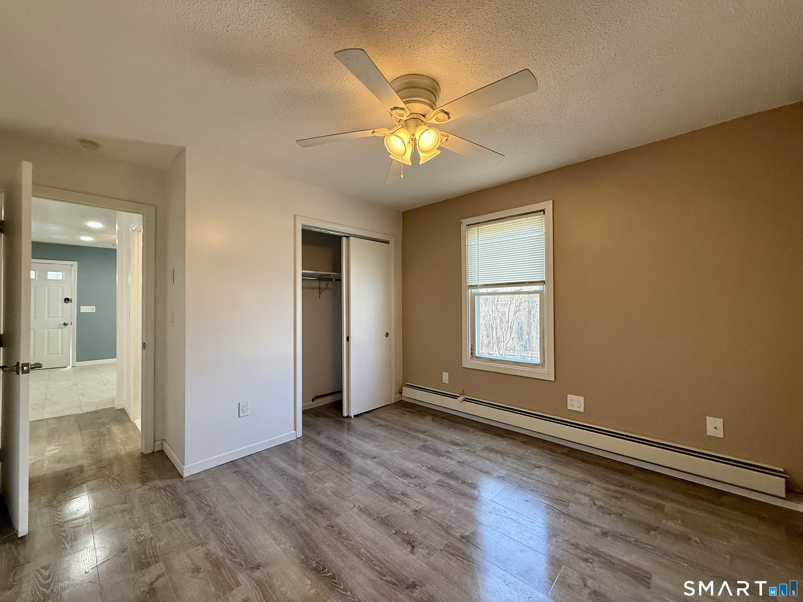 8 Scott Street, Unit 2 Naugatuck, CT 06770 - Photo 8 of 15 a view of an empty room with window and wooden floor