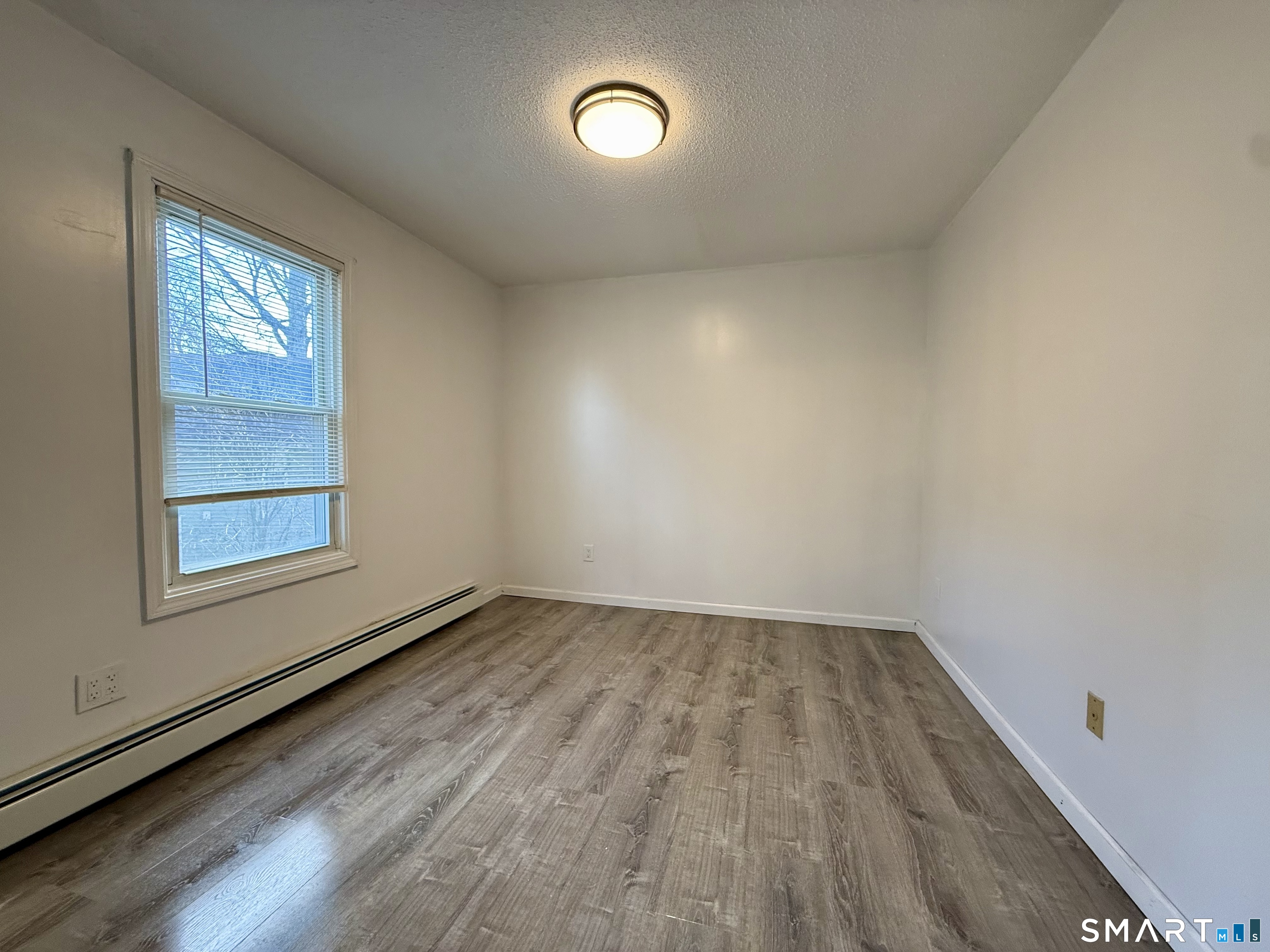 8 Scott Street, Unit 2 Naugatuck, CT 06770 - Photo 10 of 15 an empty room with a window