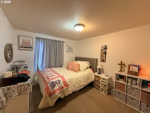 a bedroom with a bed and a closet