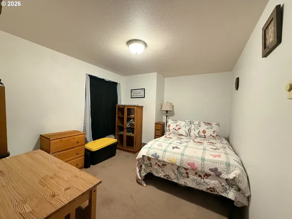 a bedroom with two beds and painted walls