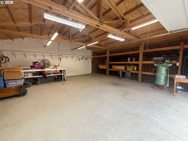 a view of a garage room with a utility room