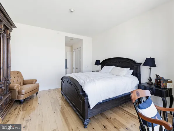 a bedroom with a bed chair and couch