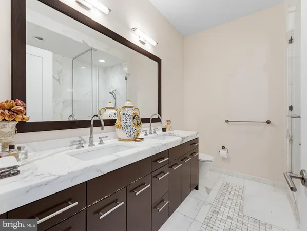 a bathroom with a double vanity sink mirror and double