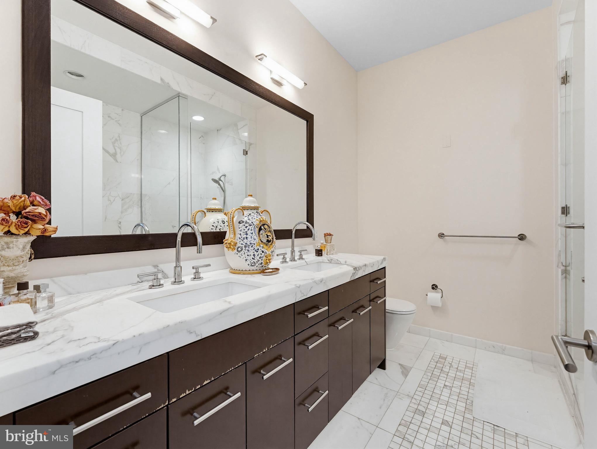 1414 South Penn Square, Unit 32F Philadelphia, PA 19102 - Photo 13 of 35 a bathroom with a double vanity sink mirror and double