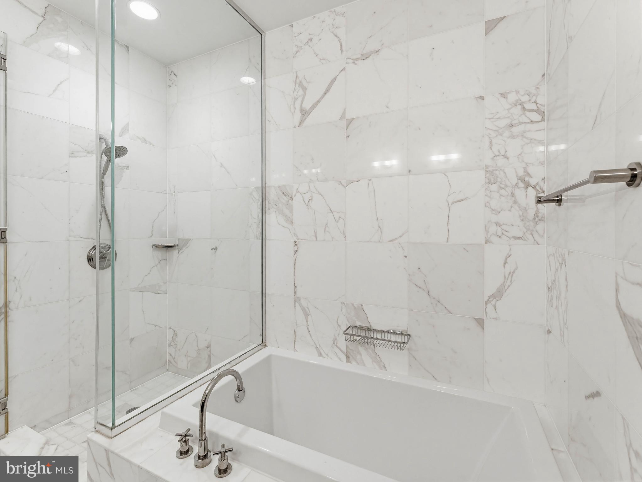 1414 South Penn Square, Unit 32F Philadelphia, PA 19102 - Photo 14 of 35 a bathroom with a bathtub and a shower