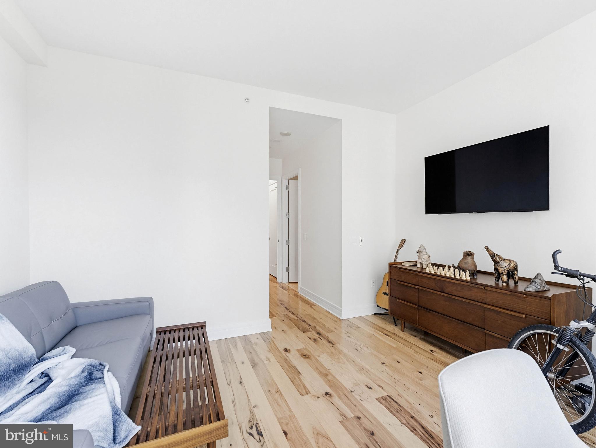 1414 South Penn Square, Unit 32F Philadelphia, PA 19102 - Photo 17 of 35 a bedroom with a bed and a flat screen tv