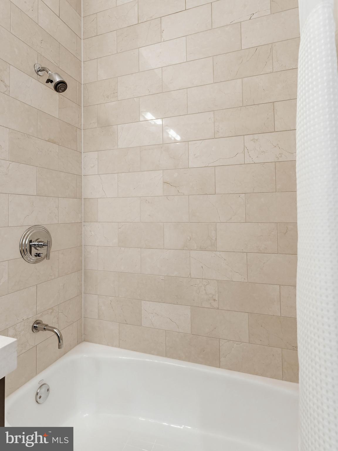 1414 South Penn Square, Unit 32F Philadelphia, PA 19102 - Photo 19 of 35 a bathroom with a bathtub