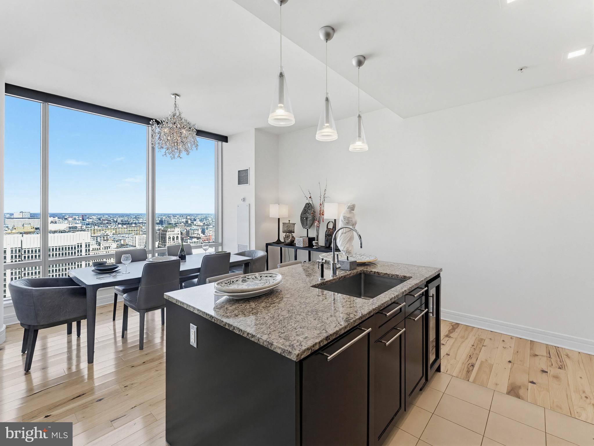 1414 South Penn Square, Unit 32F Philadelphia, PA 19102 - Photo 9 of 35 a kitchen with granite countertop a sink and cabinets