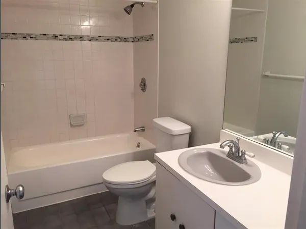 a bathroom with a sink a toilet and a bathtub