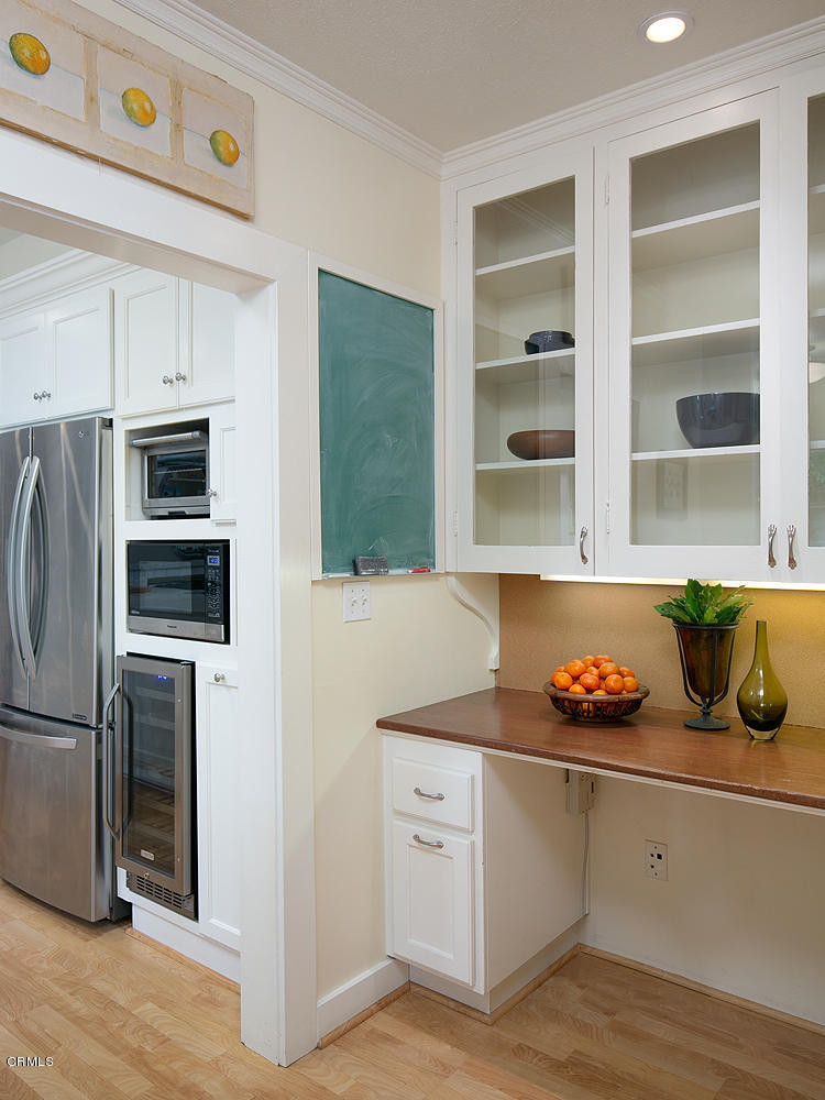 1041 Prospect Boulevard Pasadena, CA 91103 - Photo 17 of 47 a kitchen with stainless steel appliances a refrigerator sink and stove