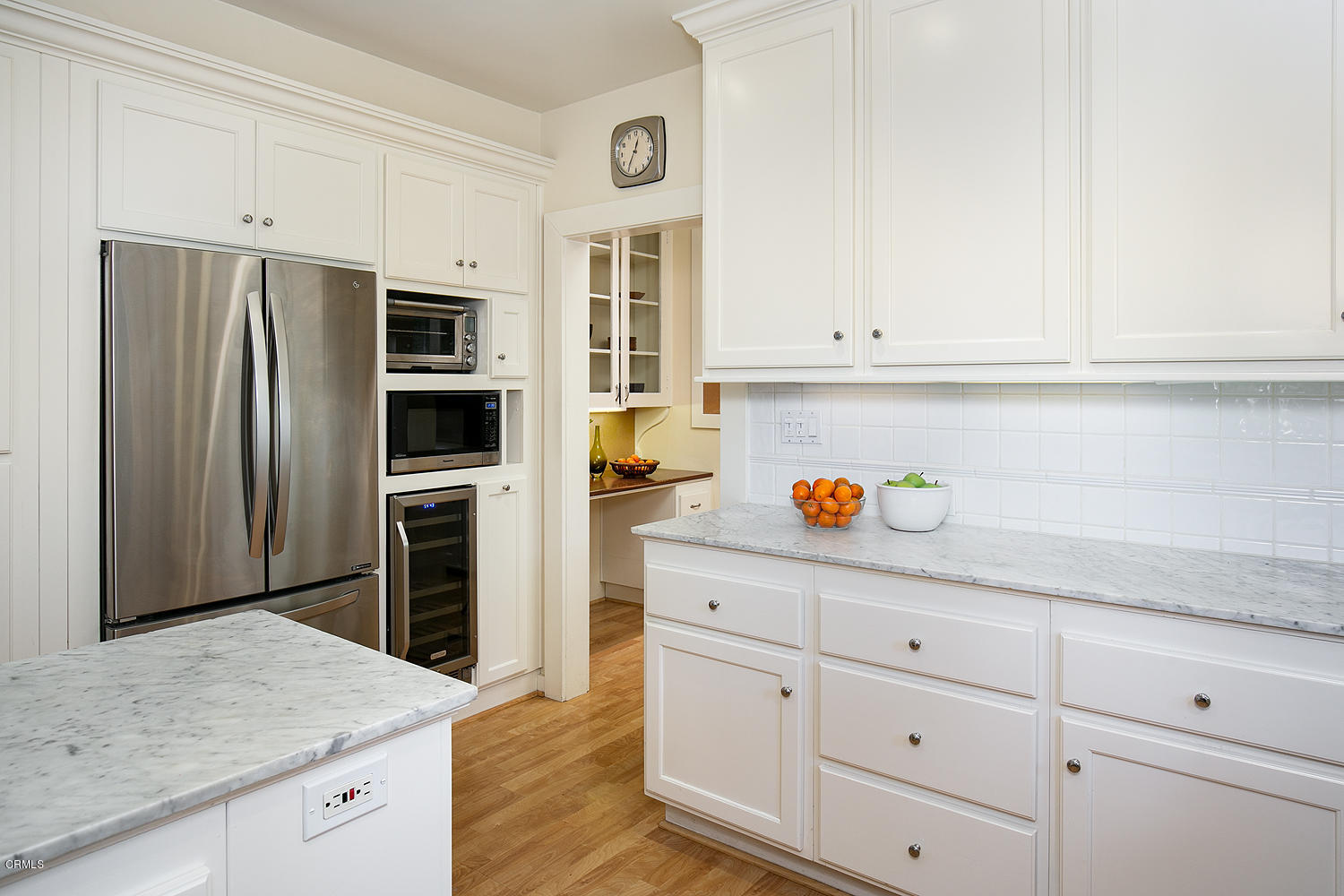 1041 Prospect Boulevard Pasadena, CA 91103 - Photo 20 of 47 a kitchen with granite countertop white cabinets and stainless steel appliances