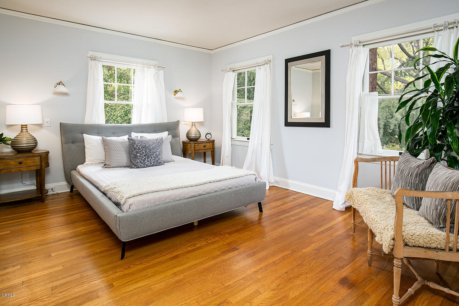 1041 Prospect Boulevard Pasadena, CA 91103 - Photo 27 of 47 a bedroom with a bed wooden floor and window