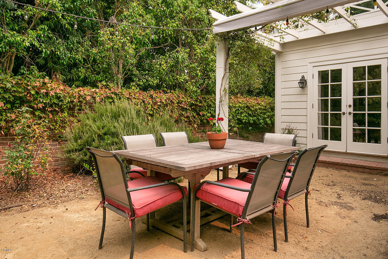 1041 Prospect Boulevard Pasadena, CA 91103 - Photo 40 of 47 a patio with table and chairs and potted plants