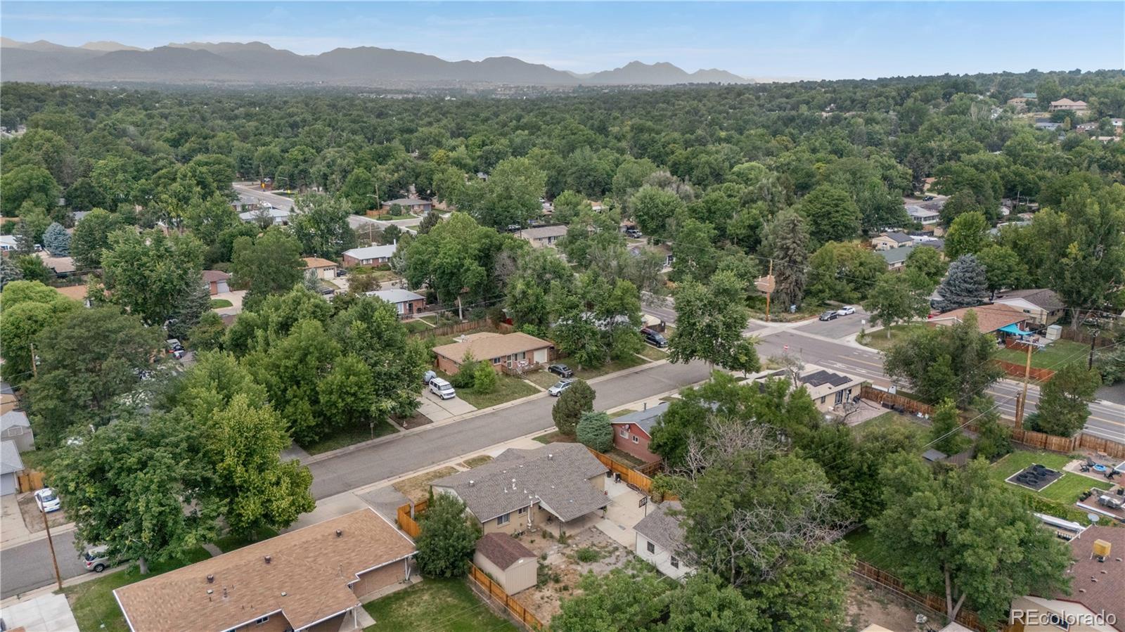 6572 Kipling Street Arvada, CO 80004 - Photo 16 of 18 an aerial view of a city with lots of residential buildings