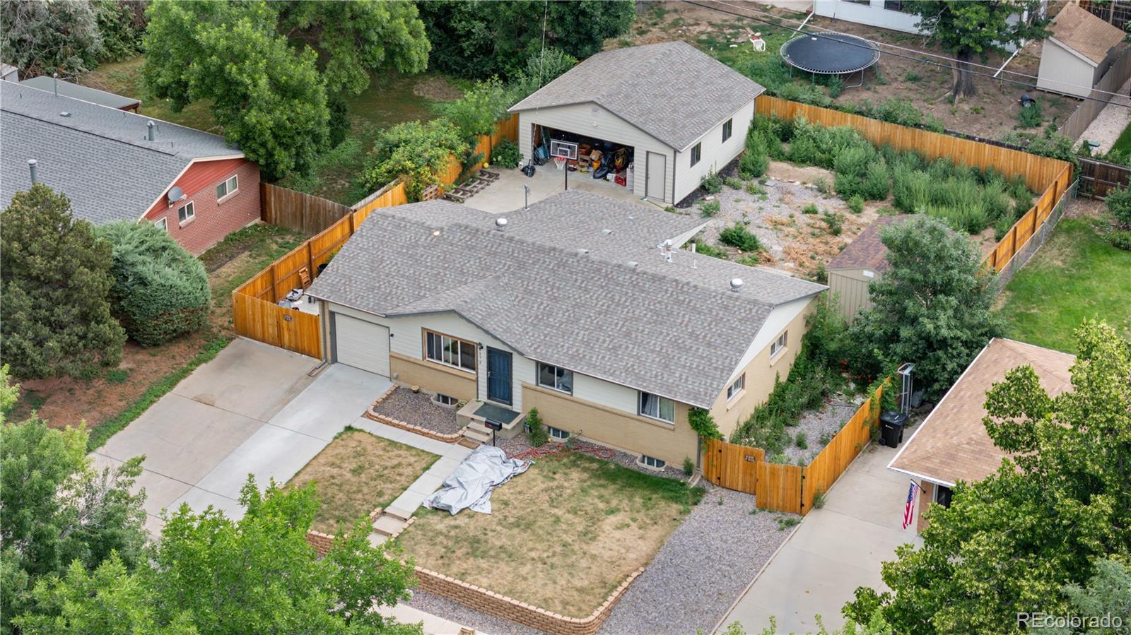 6572 Kipling Street Arvada, CO 80004 - Photo 17 of 18 an aerial view of a house with a yard