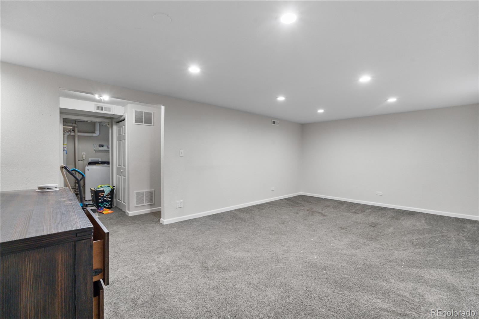 6572 Kipling Street Arvada, CO 80004 - Photo 9 of 18 a view of empty room