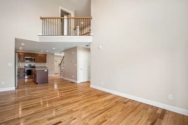 a view of a living room with wooden floor