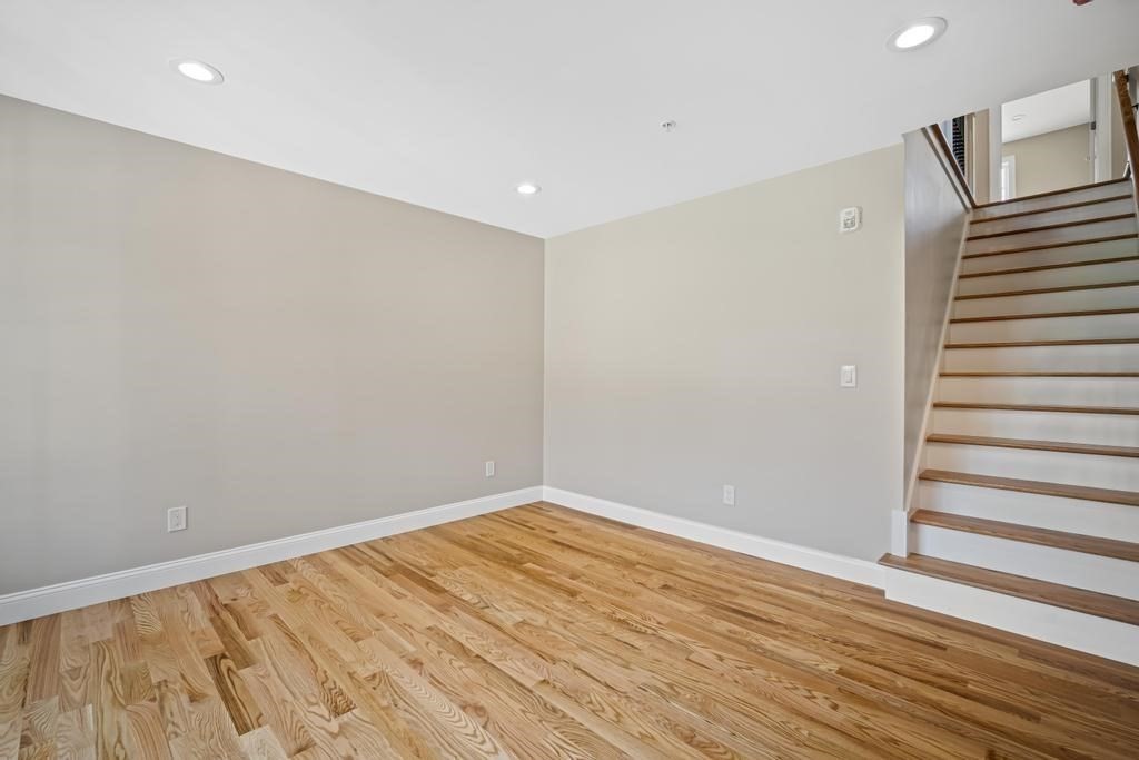 4 Sabrina Way, Unit D Feeding Hills, MA 01030 - Photo 19 of 34 a view of an empty room with wooden floor