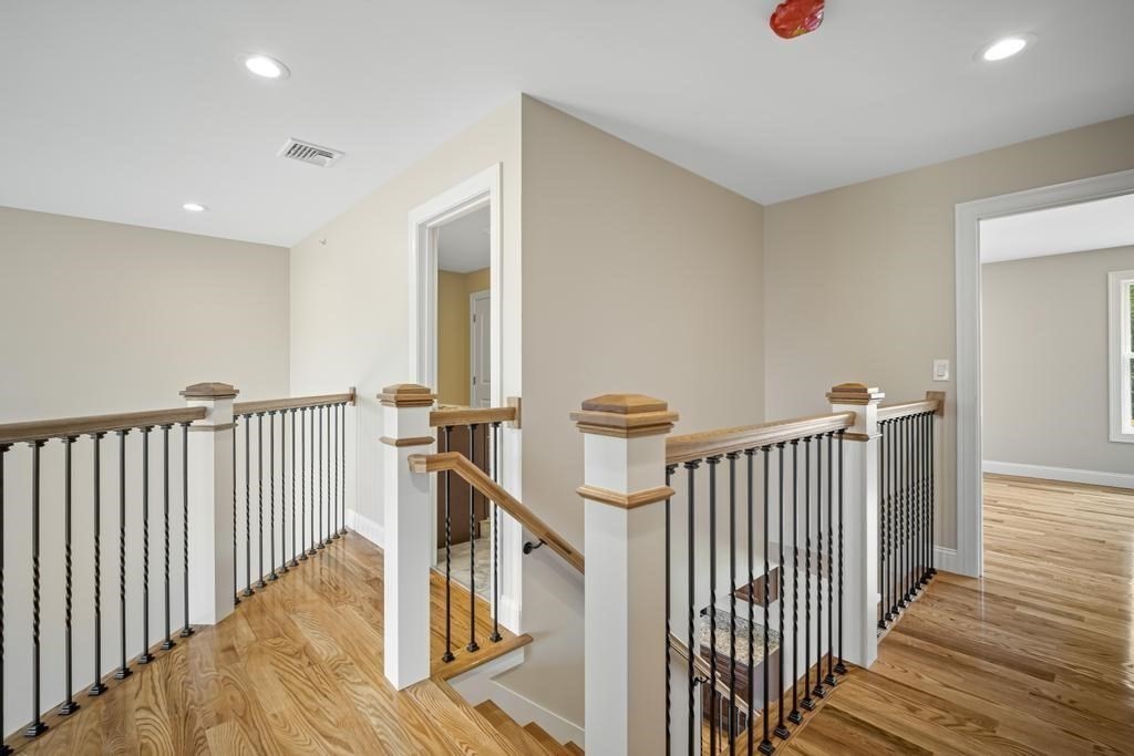 4 Sabrina Way, Unit D Feeding Hills, MA 01030 - Photo 20 of 34 a view of a hallway with wooden floor and stairs