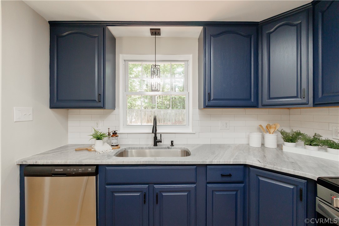 4719 Mill Park Circle Glen Allen, VA 23060 - Photo 21 of 49 a kitchen with stainless steel appliances granite countertop a sink a window and cabinets