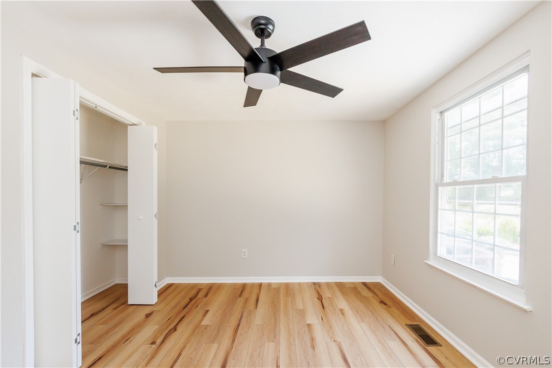 4719 Mill Park Circle Glen Allen, VA 23060 - Photo 34 of 49 wooden floor in an empty room with a window