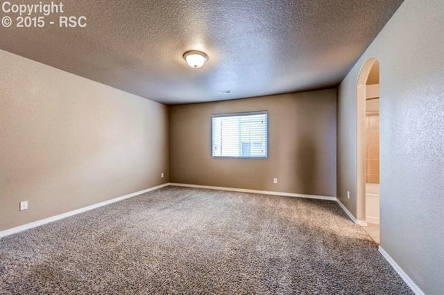 944 Diamond Rim Drive Colorado Springs, CO 80921 - Photo 18 of 28 Master bedroom with artful entrance to master bath.
