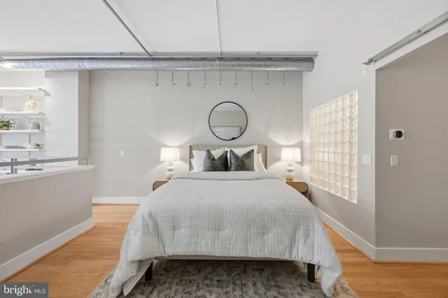 a bedroom with a bed and window