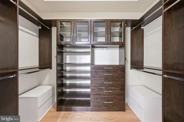 a bed room with a bed and a painting on the wall