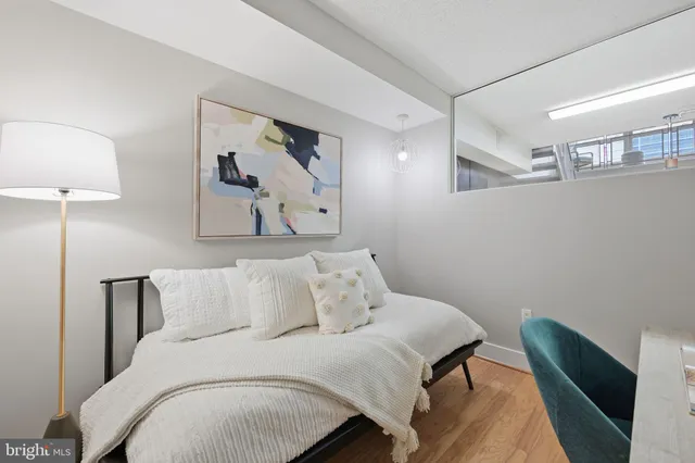 a bathroom with a granite countertop sink mirror and shower