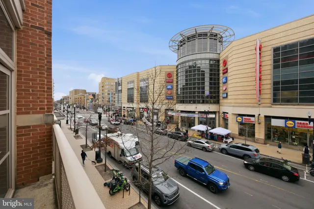 a view of a workspace with furniture and a chandelier