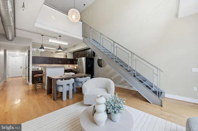 a view of entryway dining room and hall with wooden floor
