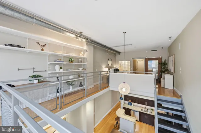 a kitchen with white cabinets and counter space