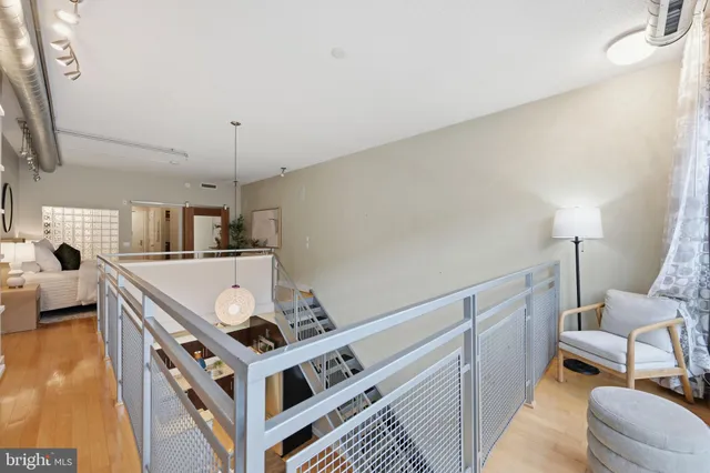 a living room with stainless steel appliances kitchen island granite countertop furniture and a kitchen view