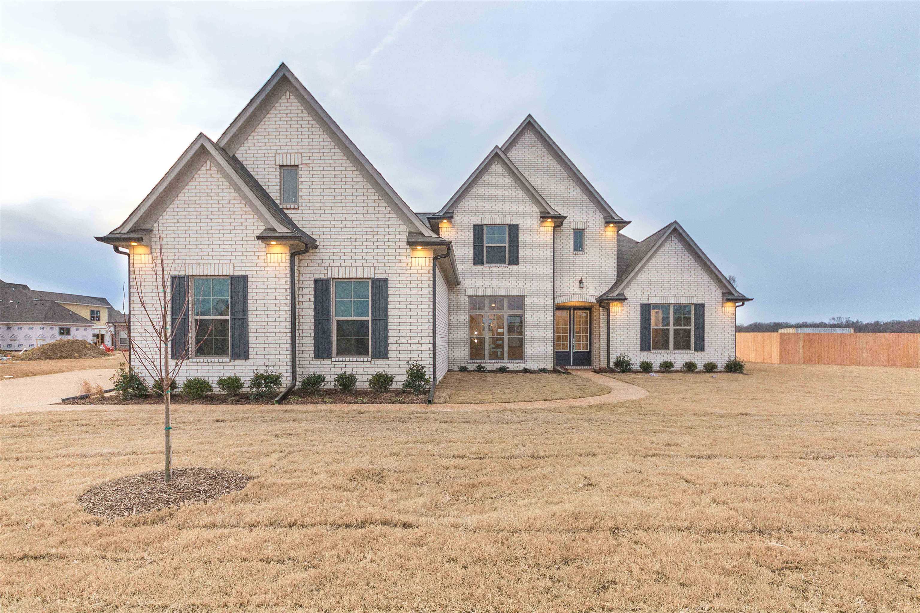 a front view of a house with a yard